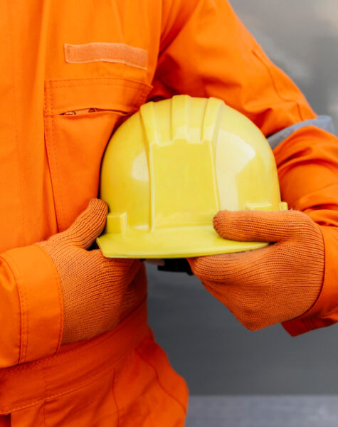 front-view-worker-uniform-holding-hard-hat